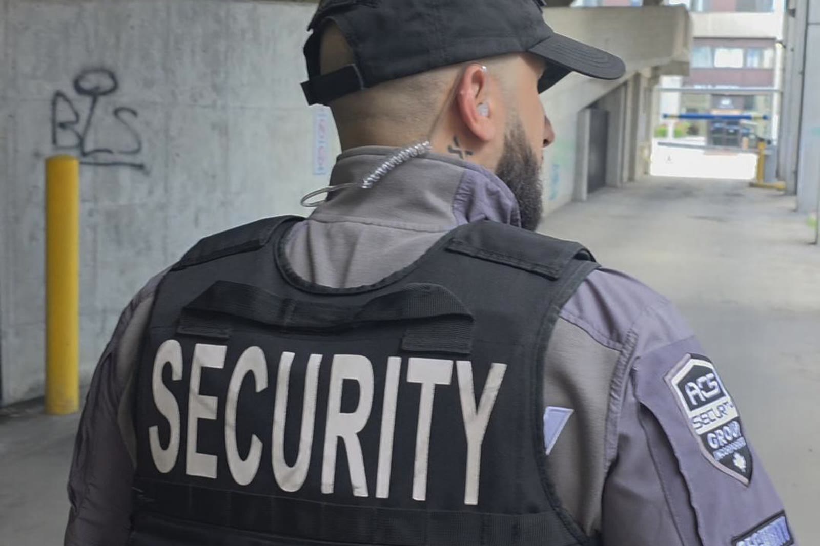 An ACS officer on foot outside a building