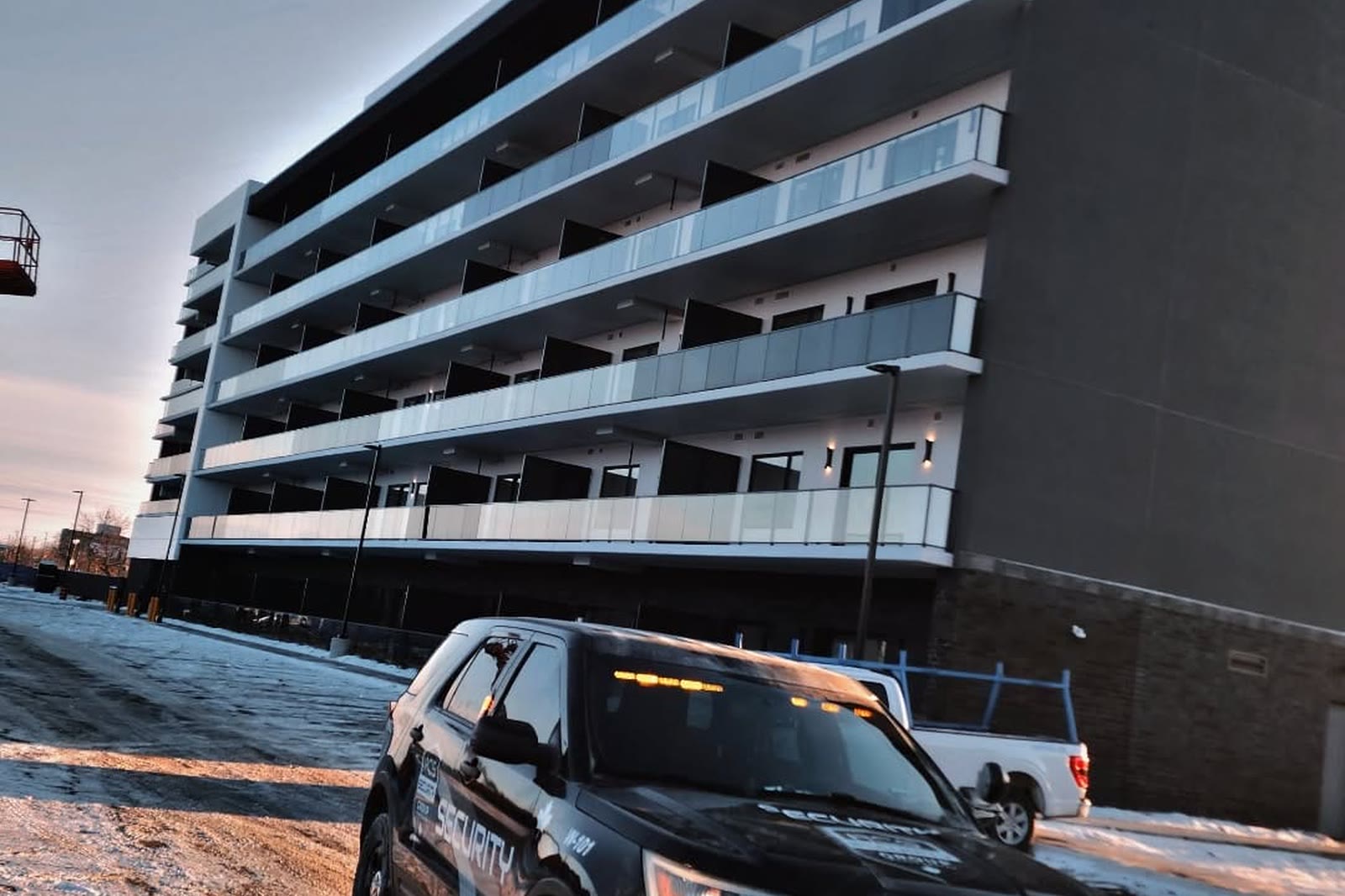 An ACS patrol vehicle parked in front of a building