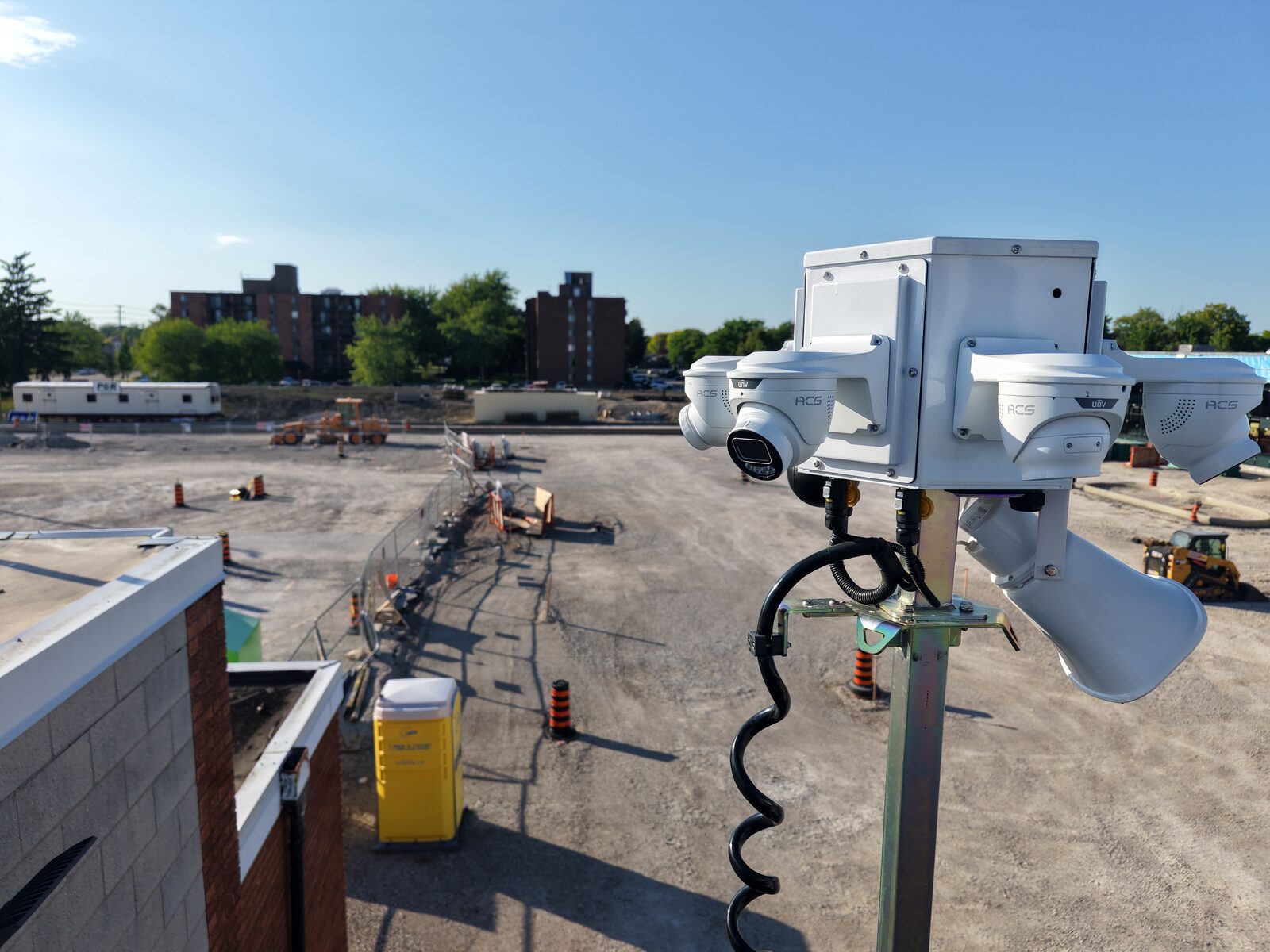 ACS multi-camera tower head overlooking an active construction lot