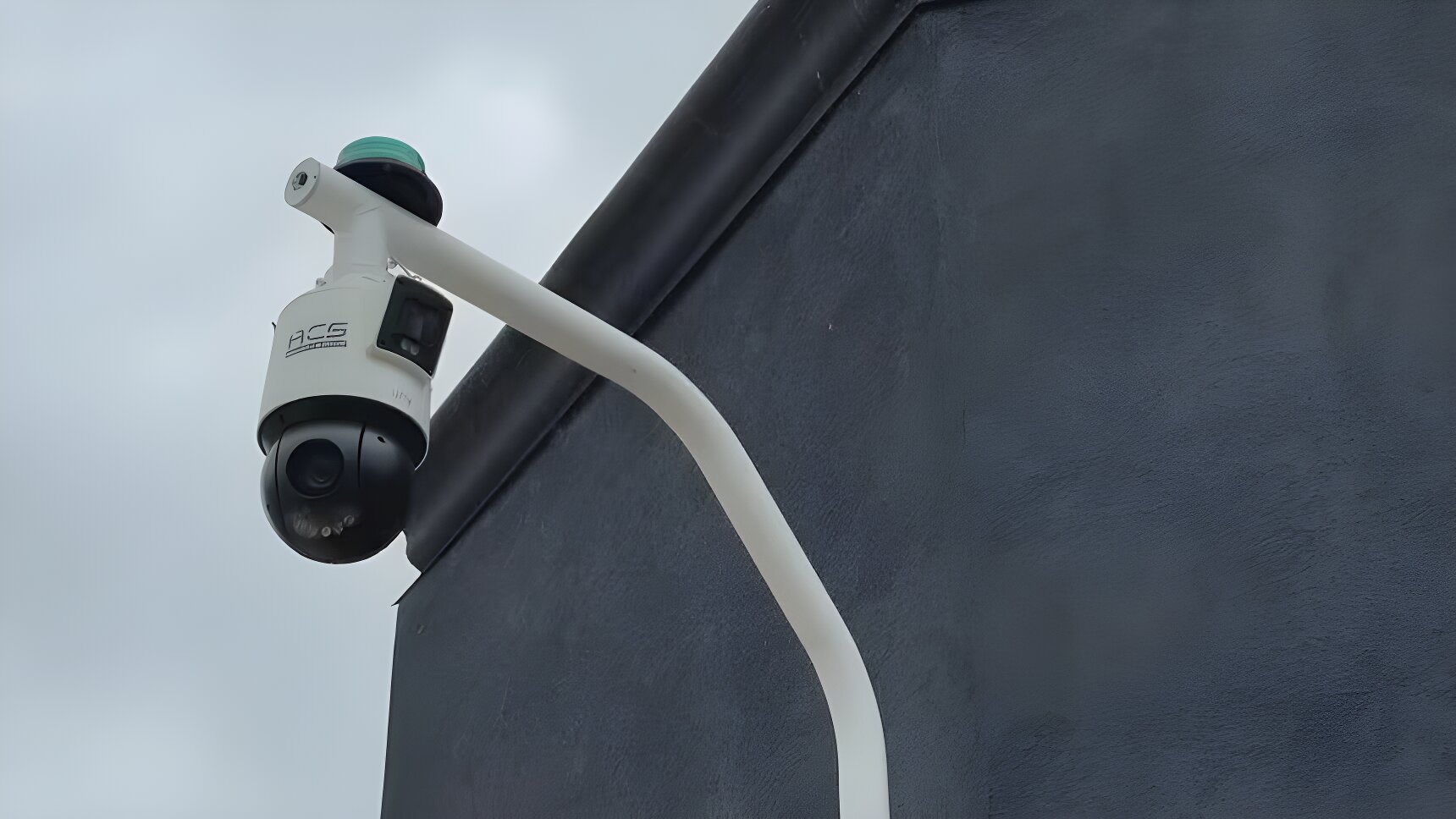 ACS camera mounted on a building wall covering the entrance