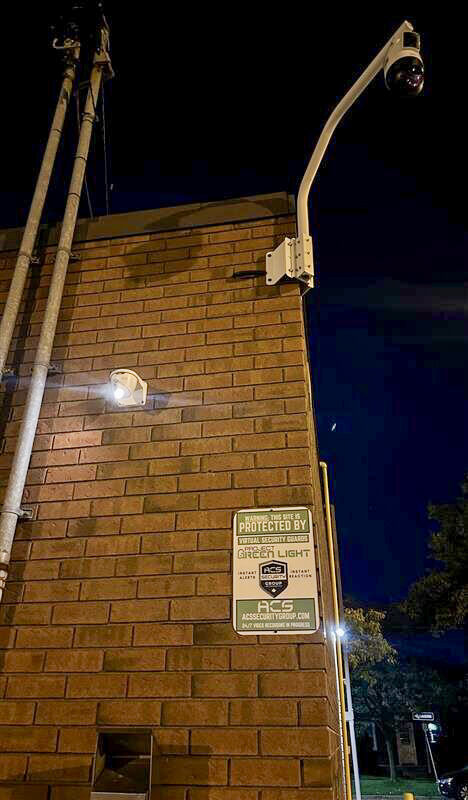 ACS camera on a building at night