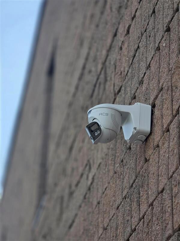ACS bullet camera on a brick wall