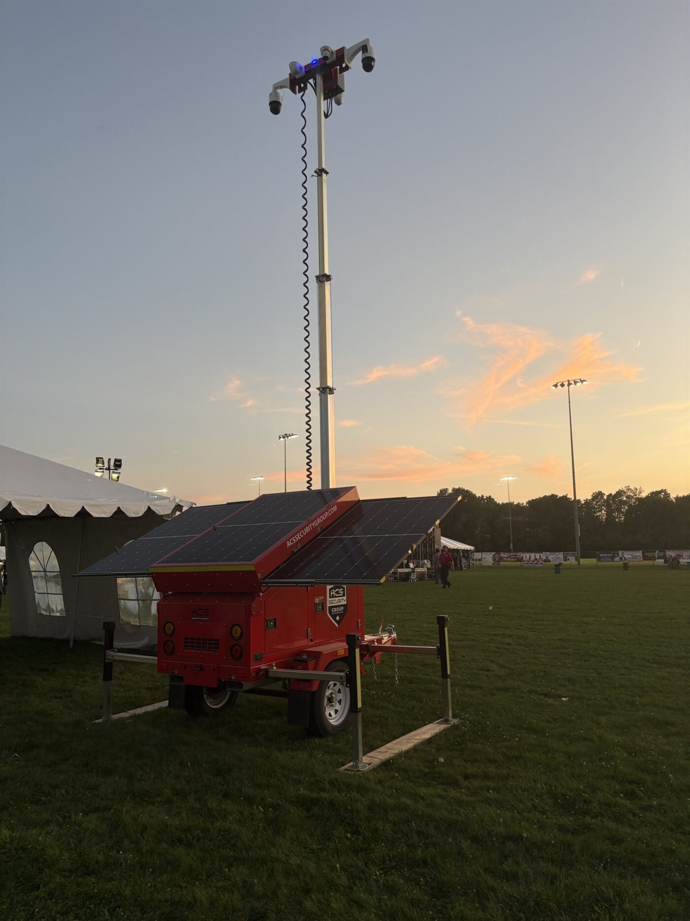 ACS solar mobile defense tower deployed at an outdoor event at dusk