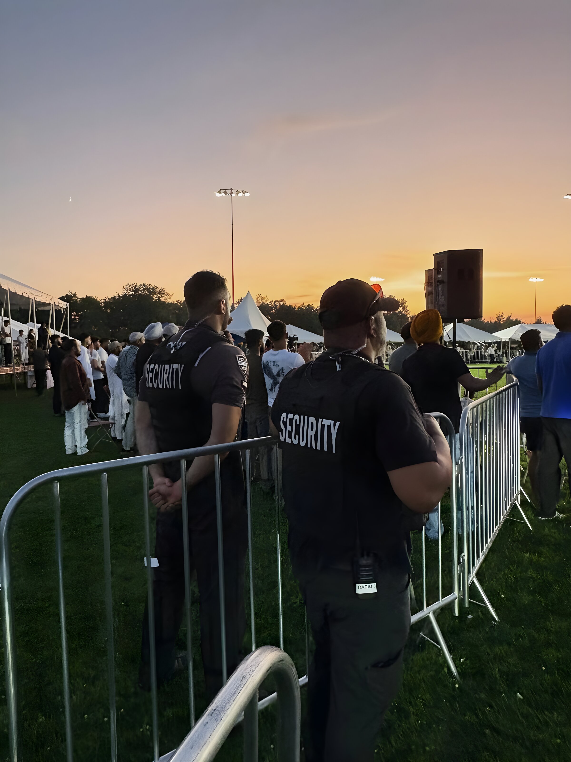 ACS event security team holding posts at an outdoor festival at sunset
