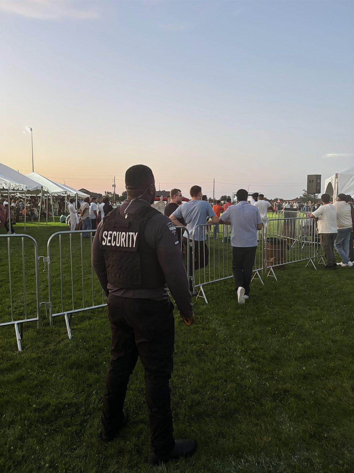 ACS event coverage at dusk, first aid and security team on a festival field