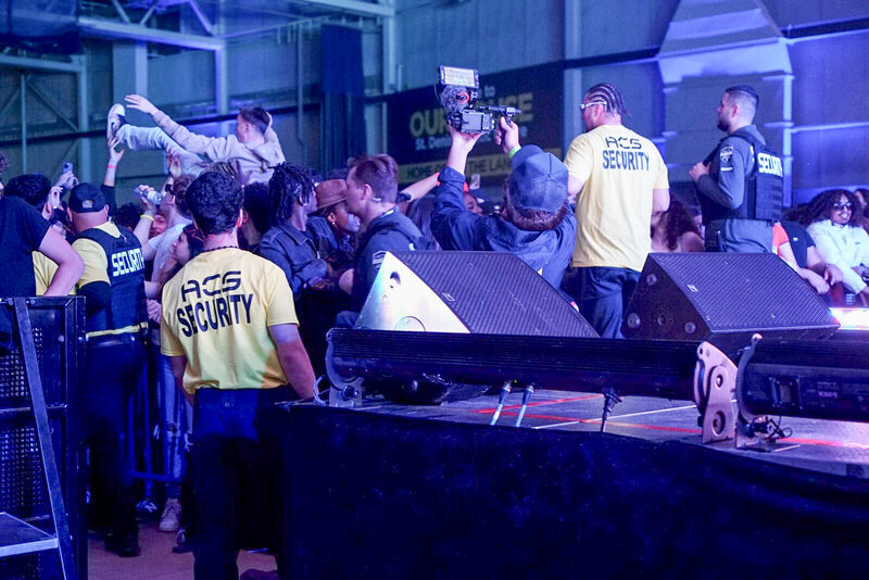 ACS team at a night event with stage lighting