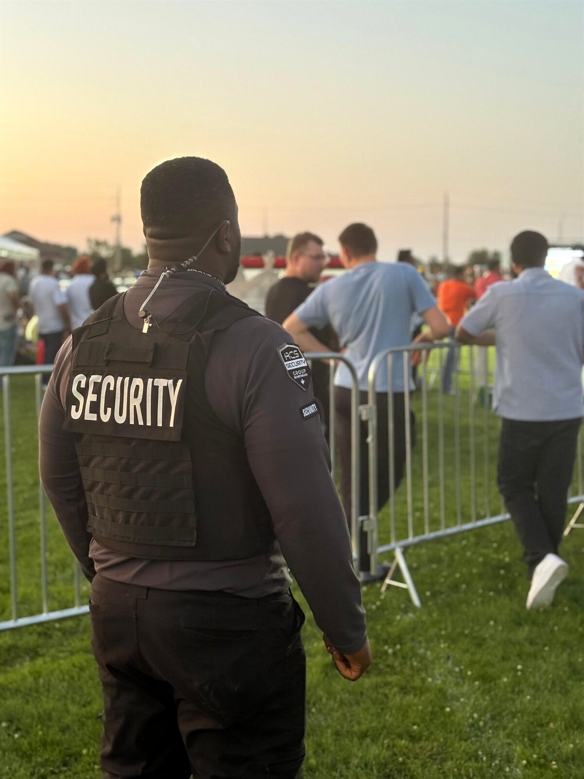 ACS guard watching a crowd at a field event