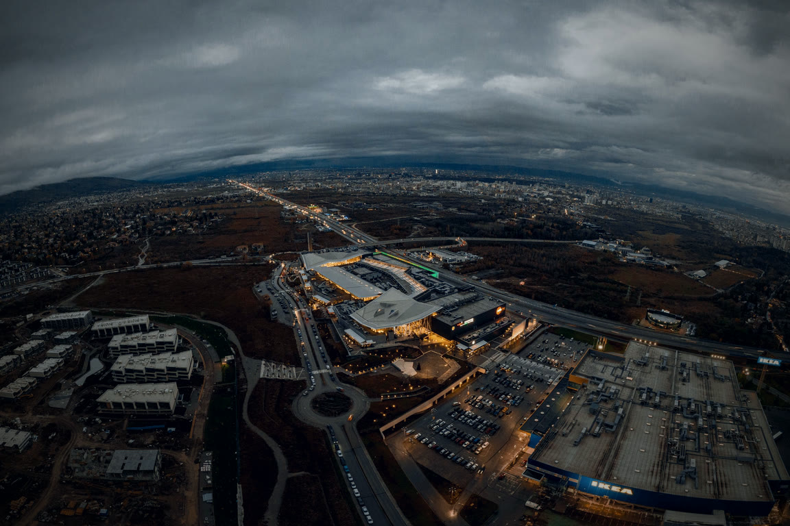 Many sites across one district, seen from the air at dusk