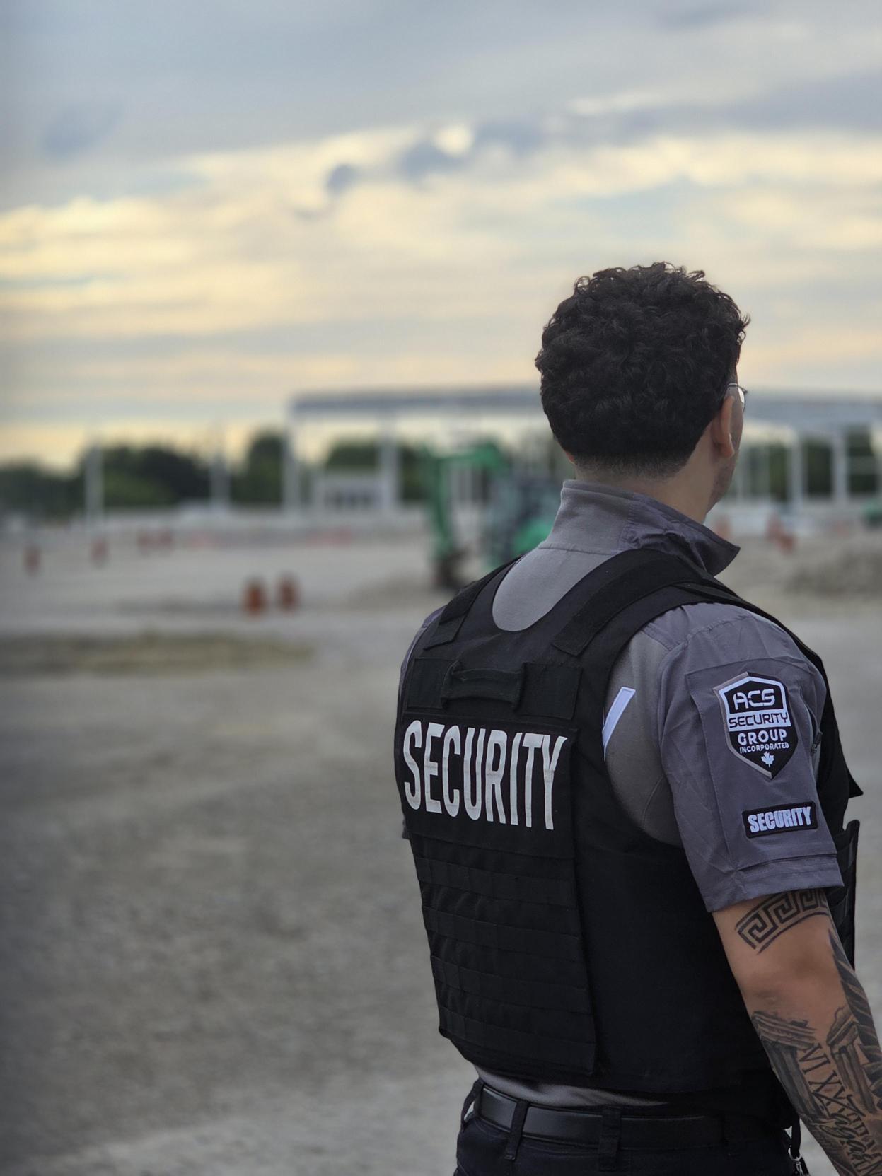 ACS security guard monitoring an active construction site