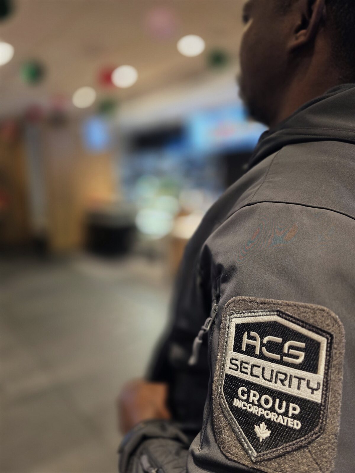 ACS Security Group shoulder patch on a guard uniform