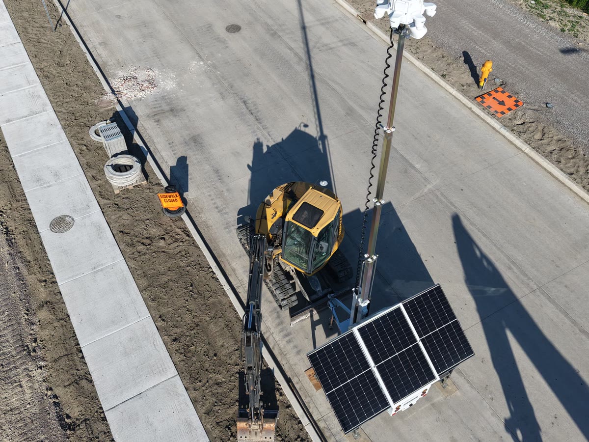 An aerial view of an ACS tower over a road construction site during earthworks
